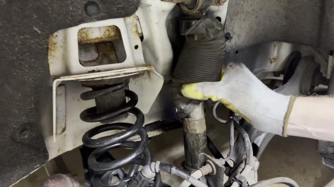 Leaking and rusted rear shock on a Honda Odyssey