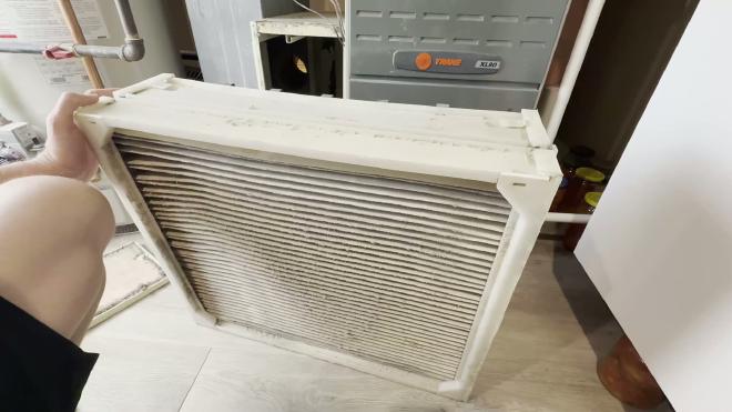 Old AprilAire 2200 filter frame after removal