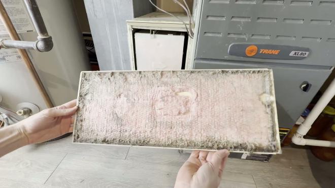Removing the old AprilAire 2200 filter from the housing