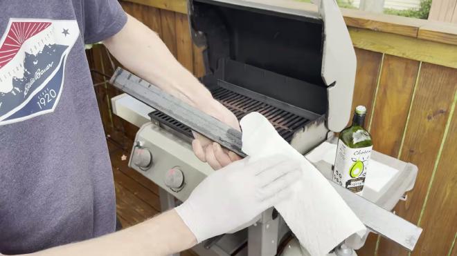 Wiping cooking oil onto the steel angle before the first use