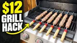 Kebabs on metal skewers resting across a steel angle rack on a gas grill