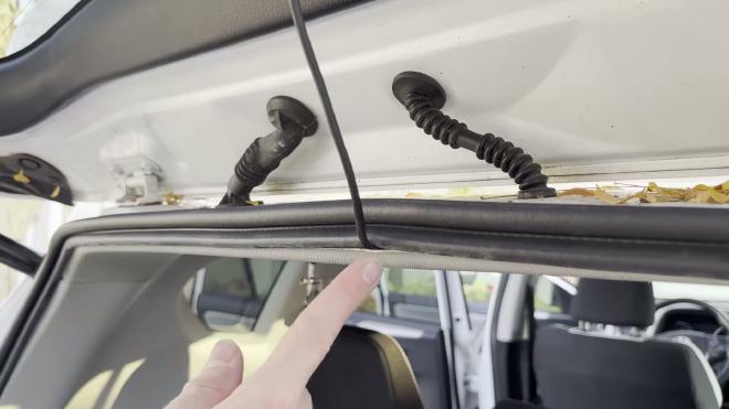 Rear camera cable exiting at the bottom of the tailgate rubber boot