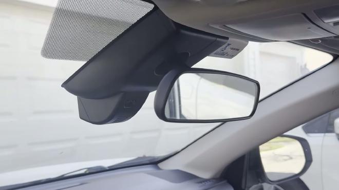 FITCAMX housing installed behind the Toyota RAV4 rearview mirror