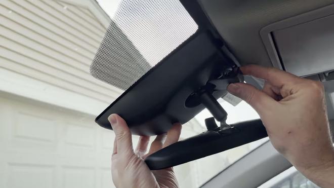 Removing the small plastic cover on top of the RAV4 mirror housing