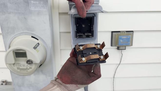 Removing the outdoor AC disconnect to cut power