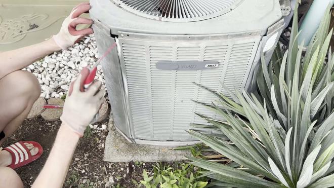 Applying lubricant to a stuck Trane AC side panel