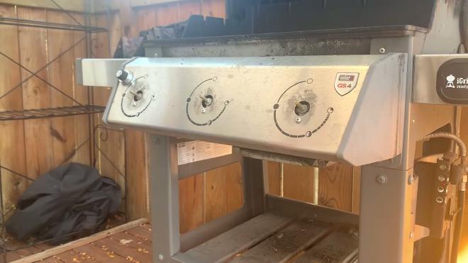 Removing the front control panel screws from the Weber grill