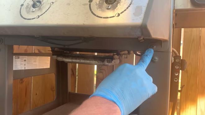 Removing the underneath screws that secure the Weber grill control panel