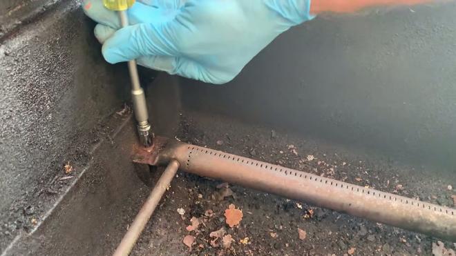 Removing the Weber grill igniter button from the control panel