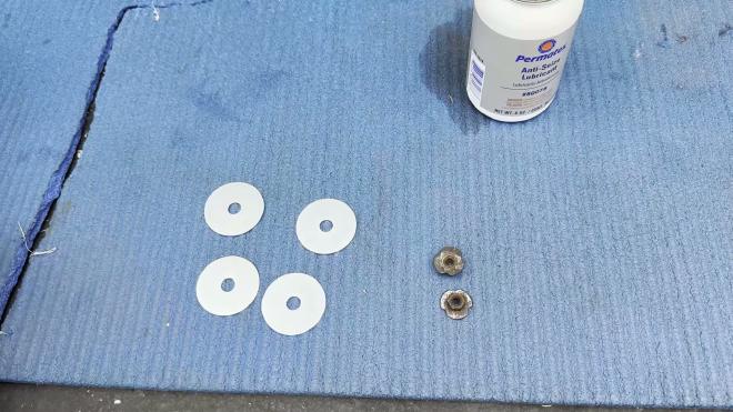 Large washer and Permatex anti-seize lubricant for the heat shield repair