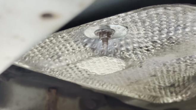 Washer and nut installed on the Toyota RAV4 exhaust heat shield