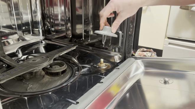 Lifting the float out of the Whirlpool dishwasher