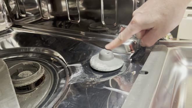 Float on the floor inside the Whirlpool dishwasher