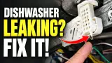 Water dripping from the white float switch housing under a Whirlpool dishwasher