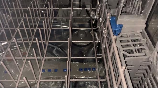 Weak water spray inside the Whirlpool dishwasher during the first test